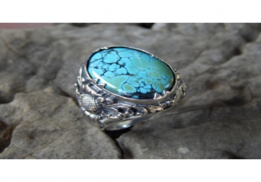 Silver ring flower motif with Turqoise stone